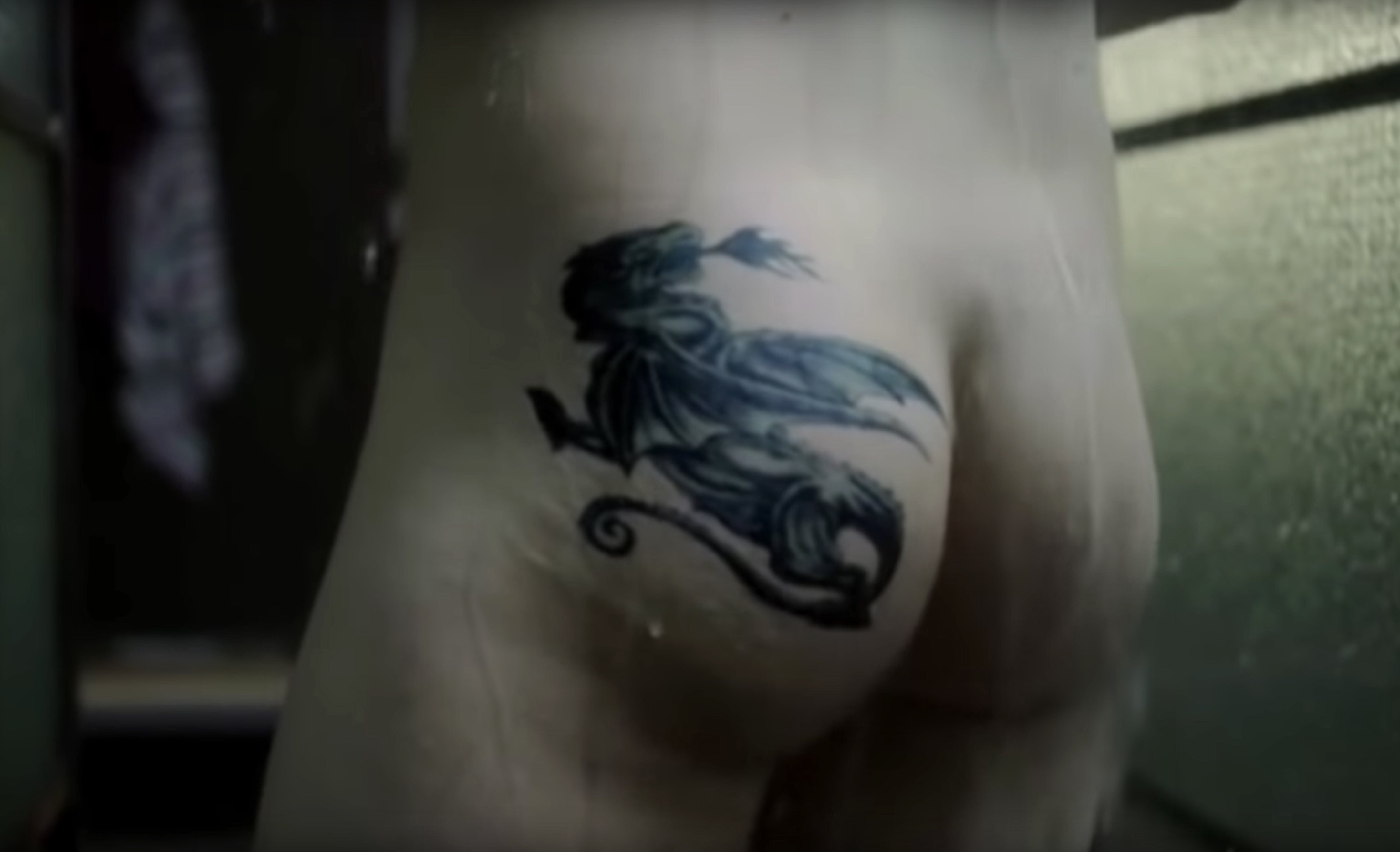 Taron Egerton showers in a scene from British TV Show 'The Smoke'