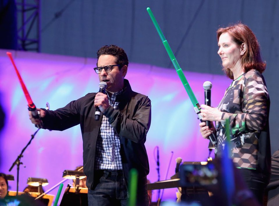 J.J. Abrams and Kathleen Kennedy with lightsabers at the Comic-Con 2015