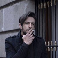 Joaquín Ferreira smoking on the street