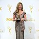 Allison Janney posing with her 2015 Emmy Award