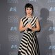 Constance Zimmer poses to photographers at 2016 Critics Choice Awards red carpet