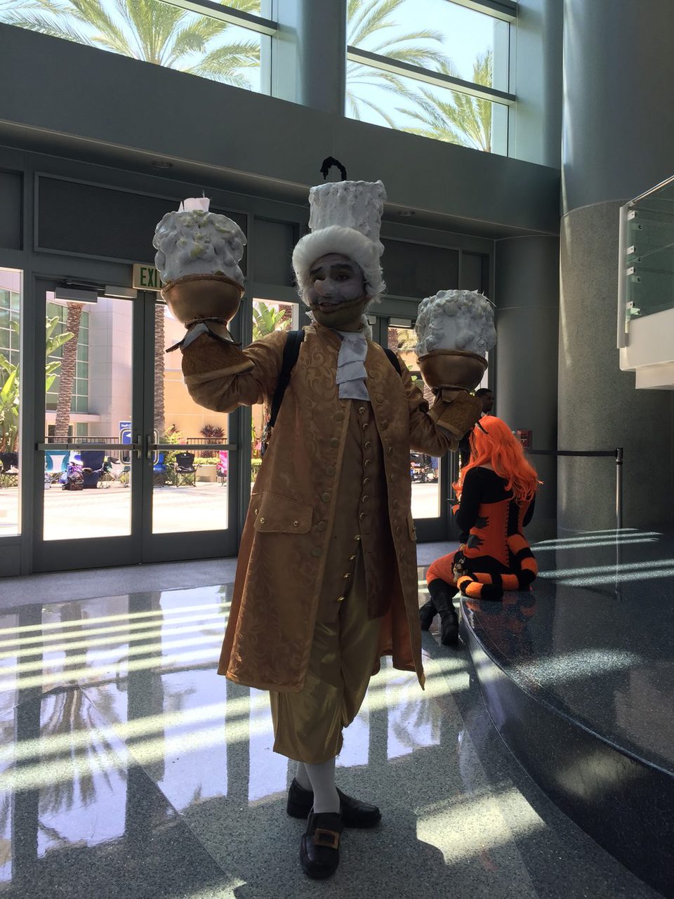 Fan dressed up like Lumiere in the D23