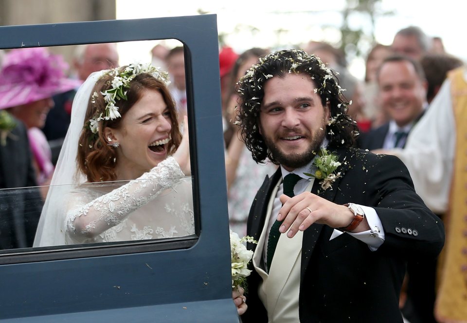 Kit Harington and Rose Leslie leave the ceremony