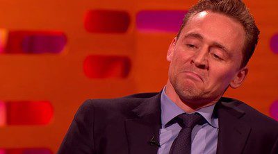 Tom Hiddleston impersonates Robert De Niro in front of him